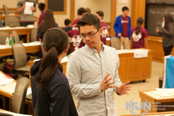 Ryan Villanueva with a student during an unmoderated caucus during the MUN Institute @ Harvard University 2015